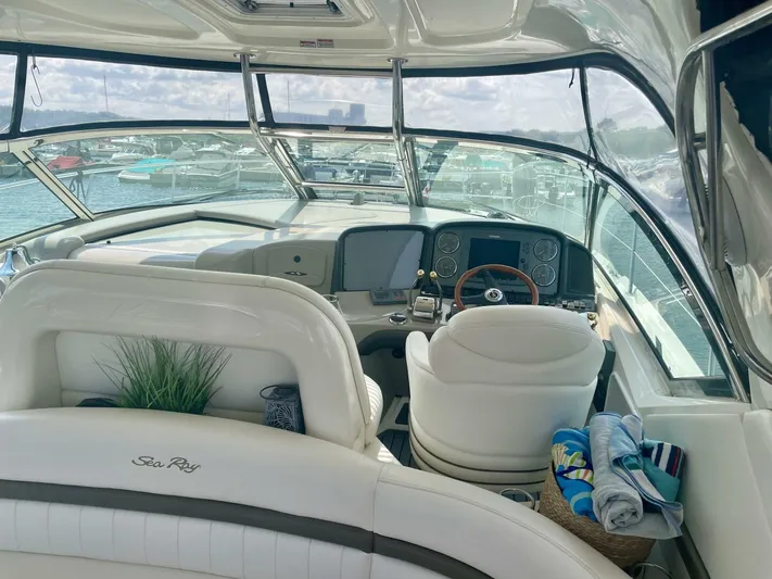  Yacht Photos Pics Interior view of 2006 Sea Ray 44 Sundancer yacht with plush seating and helm.