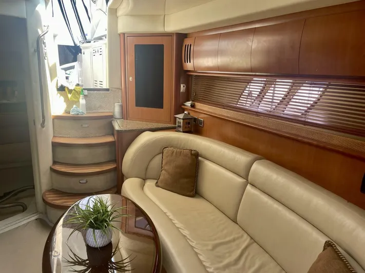  Yacht Photos Pics Interior of 2006 Sea Ray 44 Sundancer yacht with leather seating and wooden cabinetry.