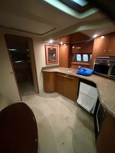  Yacht Photos Pics Interior of 2006 Sea Ray 44 Sundancer yacht with modern kitchen amenities.
