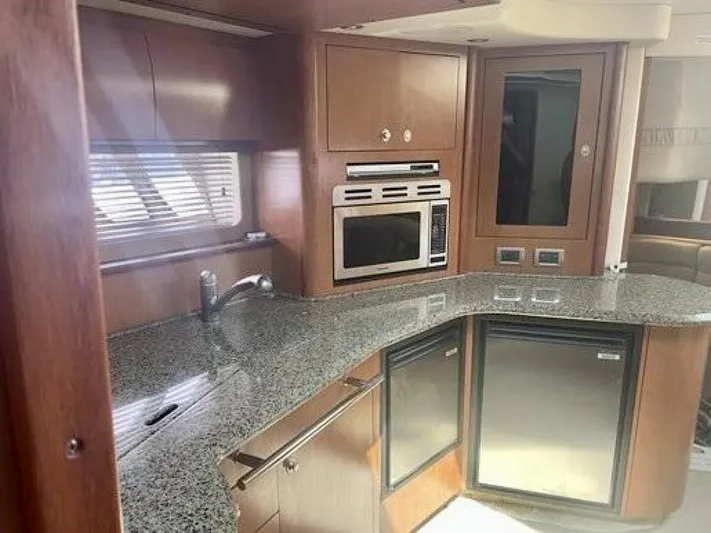  Yacht Photos Pics 2006 Sea Ray 44 Sundancer yacht kitchen with granite countertops and modern appliances.