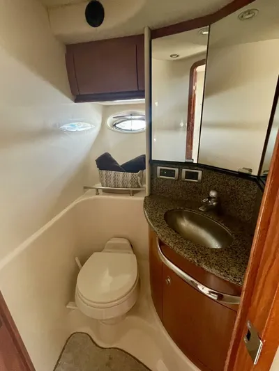  Yacht Photos Pics Luxurious bathroom in 2006 Sea Ray 44 Sundancer yacht with modern fixtures and elegant design.