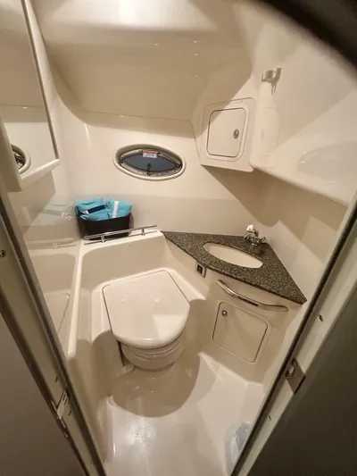  Yacht Photos Pics 2006 Sea Ray 44 Sundancer bathroom with modern fixtures and compact design.