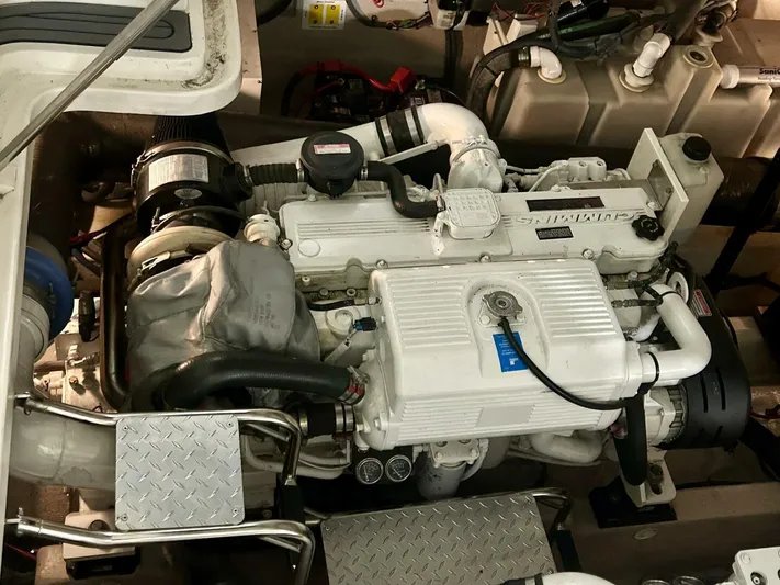  Yacht Photos Pics Engine compartment of a 2006 Sea Ray 44 Sundancer boat, showcasing detailed machinery.