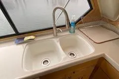 Clarity Yacht Photos Pics 1995 Navigator 50 yacht kitchen sink with dual basins and modern faucet.