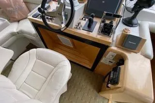 Clarity Yacht Photos Pics Interior helm of 1995 Navigator 50 yacht with steering wheel and controls.