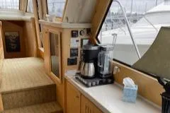 Clarity Yacht Photos Pics Interior of 1995 Navigator 50 yacht with coffee maker and control panel.