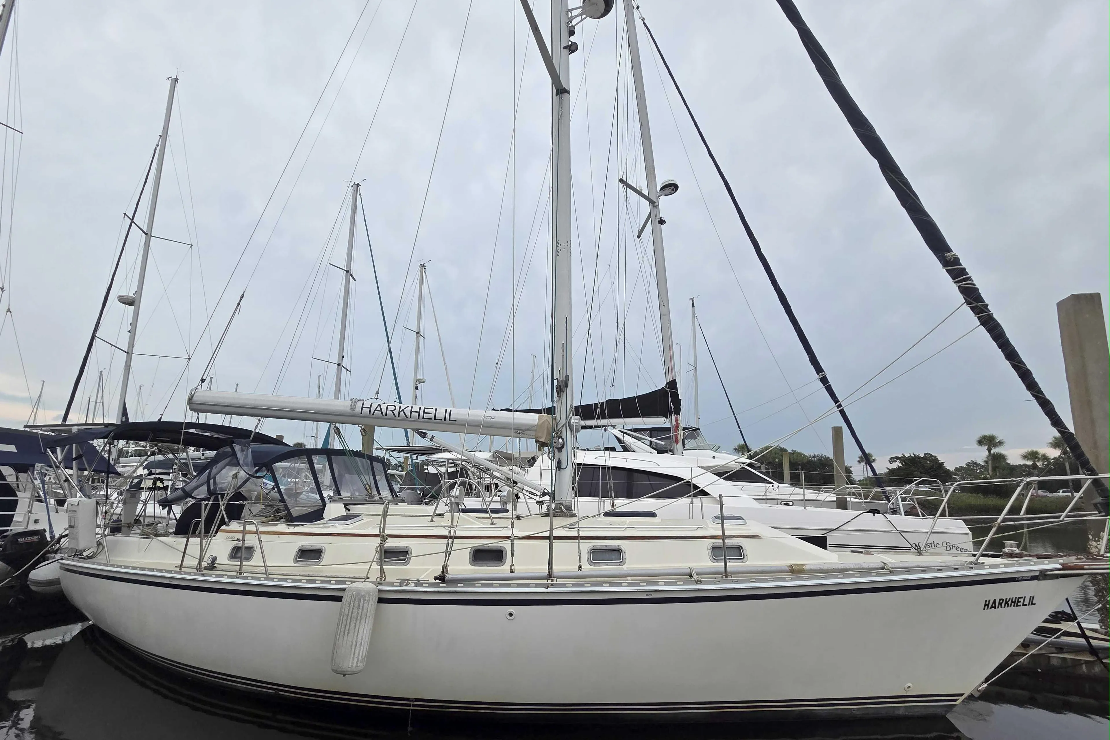 2001 Caliber 40LRC sailboat docked at marina, featuring sleek design and multiple masts.