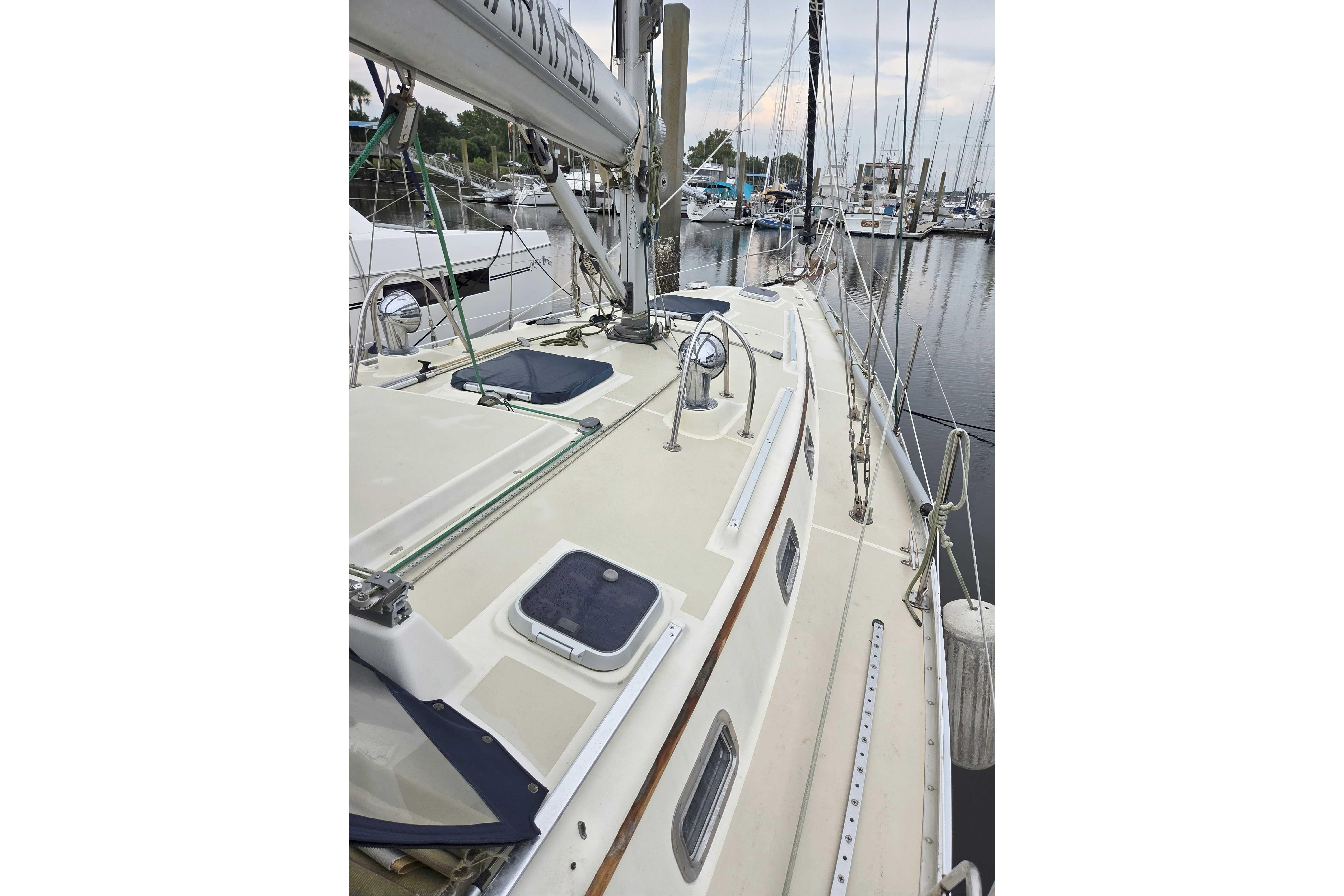 2001 Caliber 40LRC sailboat deck view in marina setting.