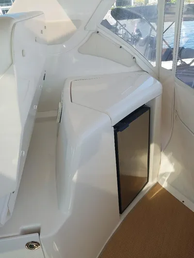 Hope Anne II Yacht Photos Pics 2003 Tiara Yachts 4400 Sovran interior with compact fridge and sleek white design.