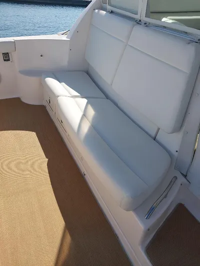 Hope Anne II Yacht Photos Pics 2003 Tiara Yachts 4400 Sovran interior with white seating and beige flooring.