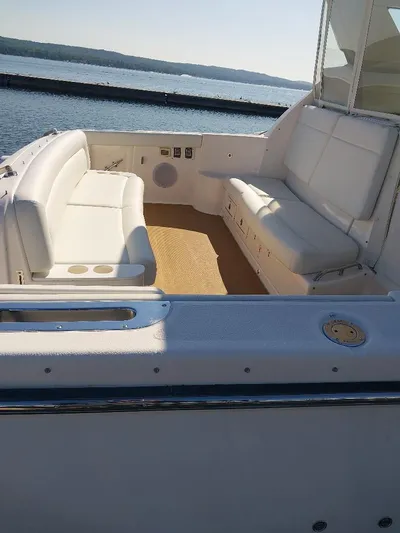 Hope Anne II Yacht Photos Pics 2003 Tiara Yachts 4400 Sovran cockpit with white seating, overlooking calm waters.