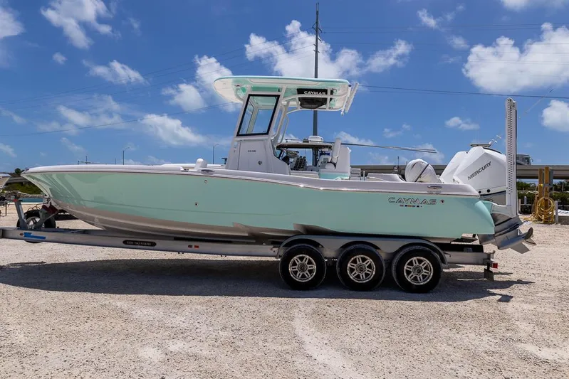  Yacht Photos Pics 2025 Caymas 281 HB boat on a trailer under a clear blue sky.
