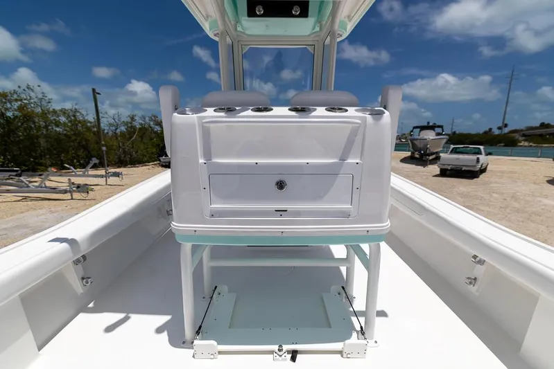  Yacht Photos Pics 2025 Caymas 281 HB boat interior with console, under clear blue sky.