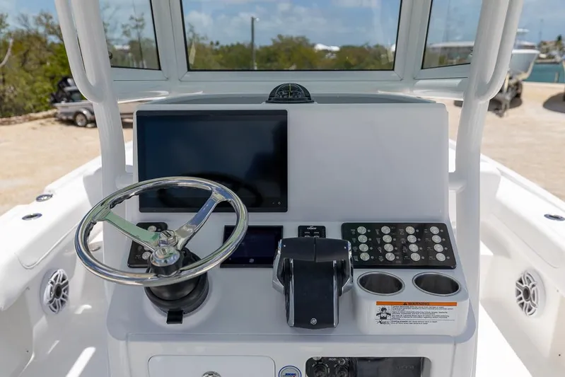  Yacht Photos Pics 2025 Caymas 281 HB boat dashboard with steering wheel and control panel.