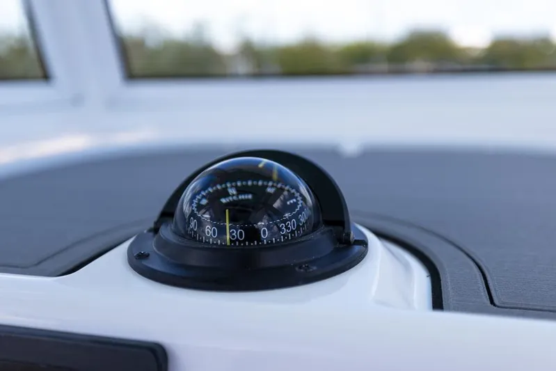  Yacht Photos Pics Compass on 2025 Caymas 281 HB boat dashboard, close-up view.