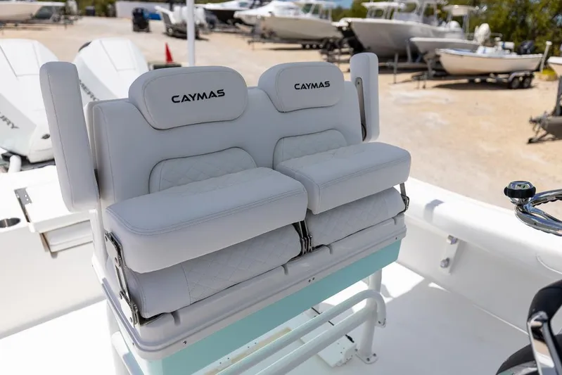  Yacht Photos Pics 2025 Caymas 281 HB boat seats, featuring plush white cushions and branded headrests.