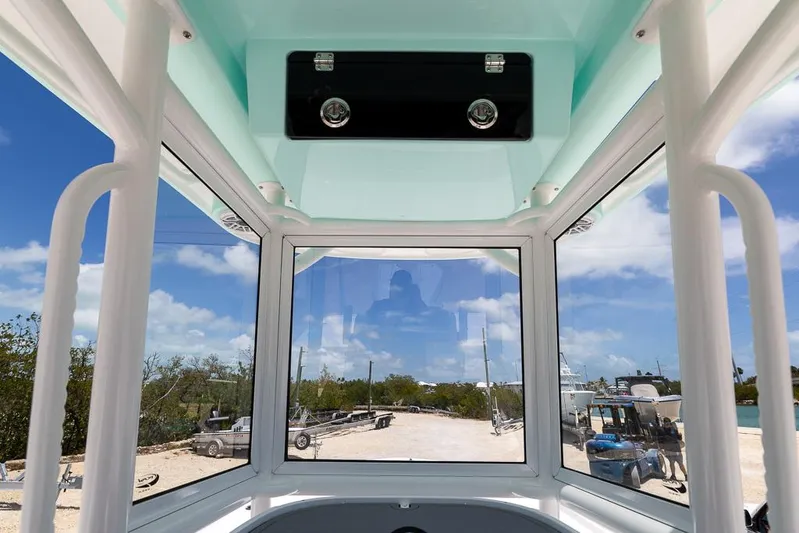  Yacht Photos Pics Interior view of 2025 Caymas 281 HB boat with clear windows and blue sky.