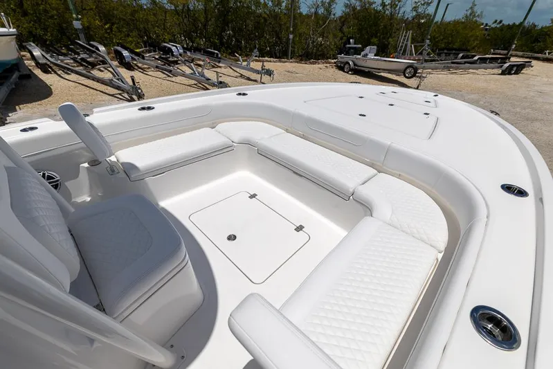  Yacht Photos Pics 2025 Caymas 281 HB boat with spacious white seating and storage compartments.