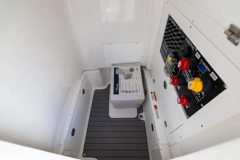  Yacht Photos Pics 2025 Caymas 281 HB boat interior with control panel and storage area.