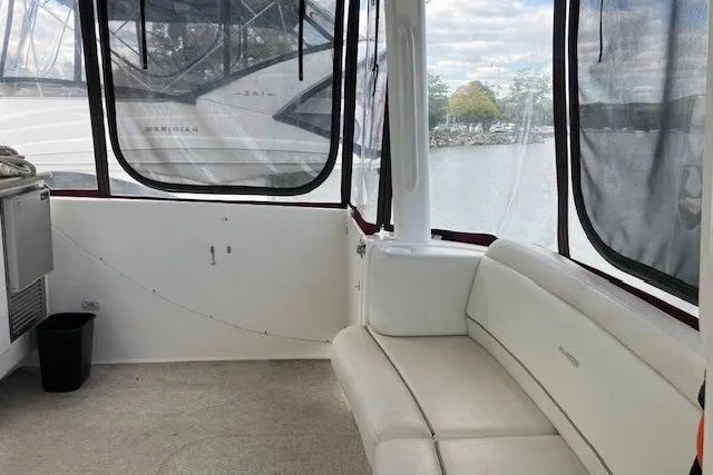  Yacht Photos Pics 2006 Silverton 39 Motor Yacht interior with white seating and large windows.