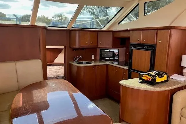  Yacht Photos Pics Interior of 2006 Silverton 39 Motor Yacht with wood cabinetry and modern amenities.