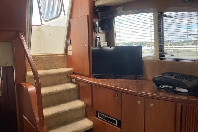  Yacht Photos Pics Interior of 2006 Silverton 39 Motor Yacht with stairs, TV, and window view.