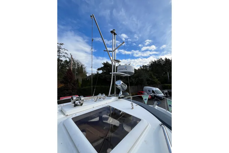 Rockin' Robin Yacht Photos Pics 2009 Ranger Tugs R-29 boat with Garmin radar, under a partly cloudy sky.