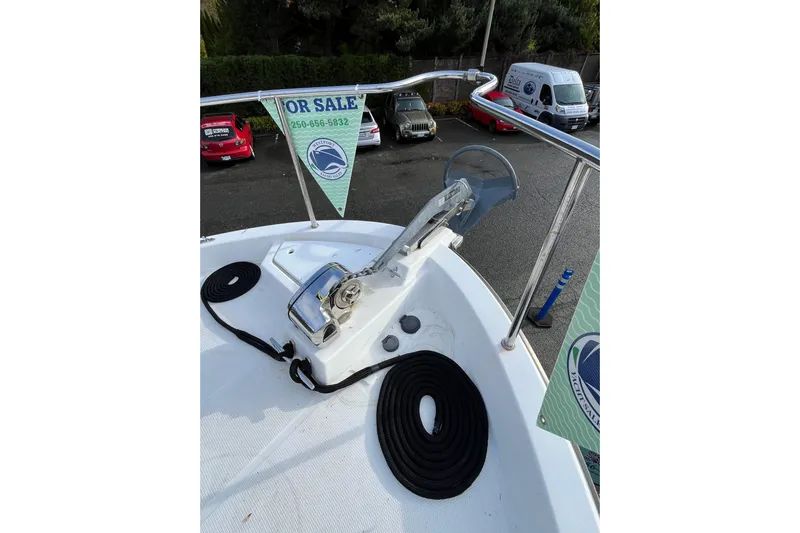 Rockin' Robin Yacht Photos Pics 2009 Ranger Tugs R-29 boat deck with anchor, for sale sign visible.