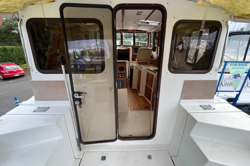 Rockin' Robin Yacht Photos Pics 2009 Ranger Tugs R-29 interior view, showcasing cabin and cockpit area.