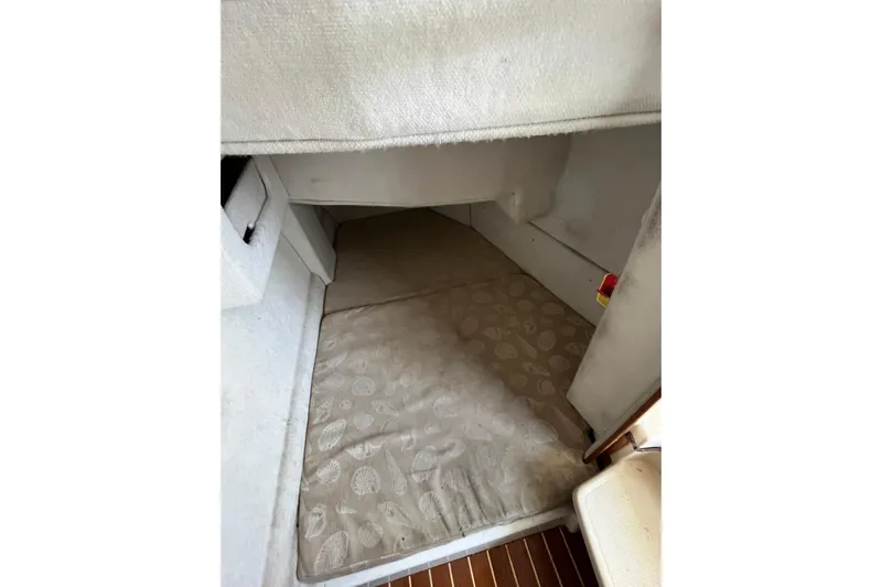 Rockin' Robin Yacht Photos Pics 2009 Ranger Tugs R-29 interior cabin with cushioned sleeping area.