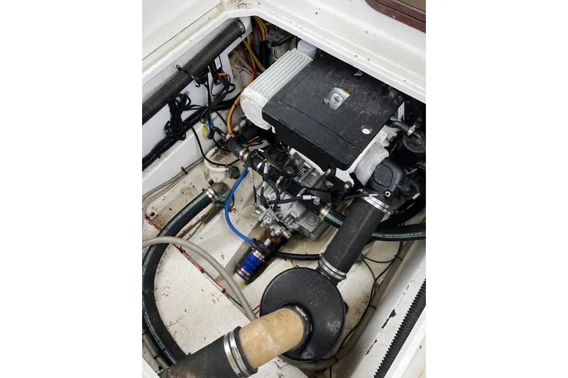 Rockin' Robin Yacht Photos Pics Engine compartment of 2009 Ranger Tugs R-29, showcasing mechanical components and wiring.