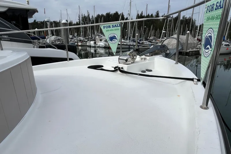 Rockin' Robin Yacht Photos Pics 2009 Ranger Tugs R-29 boat for sale at marina, surrounded by other vessels.