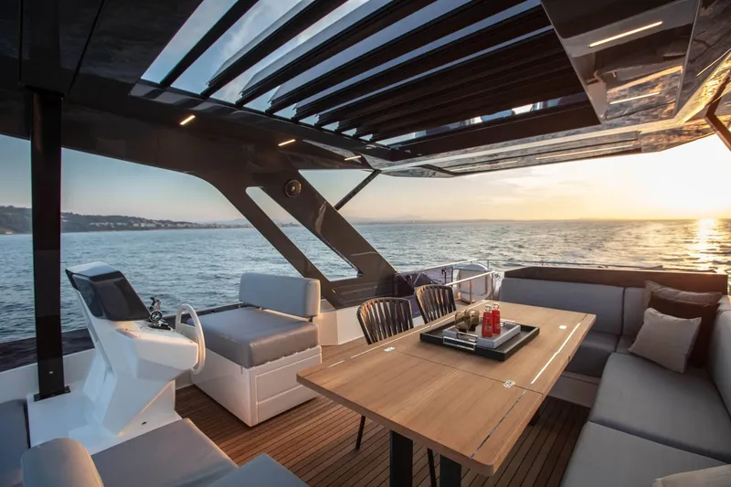  Yacht Photos Pics Luxurious 2025 Ferretti Yachts 720 interior with ocean view at sunset.