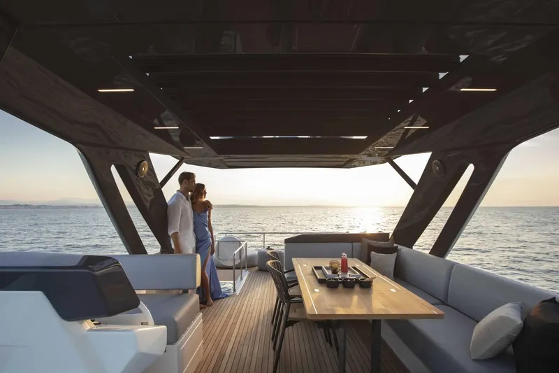  Yacht Photos Pics Couple enjoying sunset on 2025 Ferretti Yachts 720, luxurious deck view.