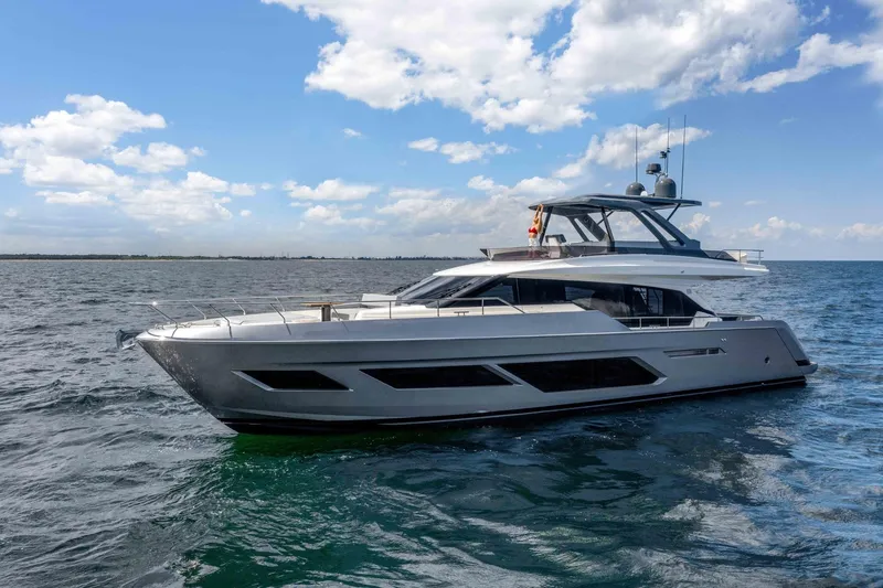  Yacht Photos Pics 2025 Ferretti Yachts 720 cruising on open water under a partly cloudy sky.