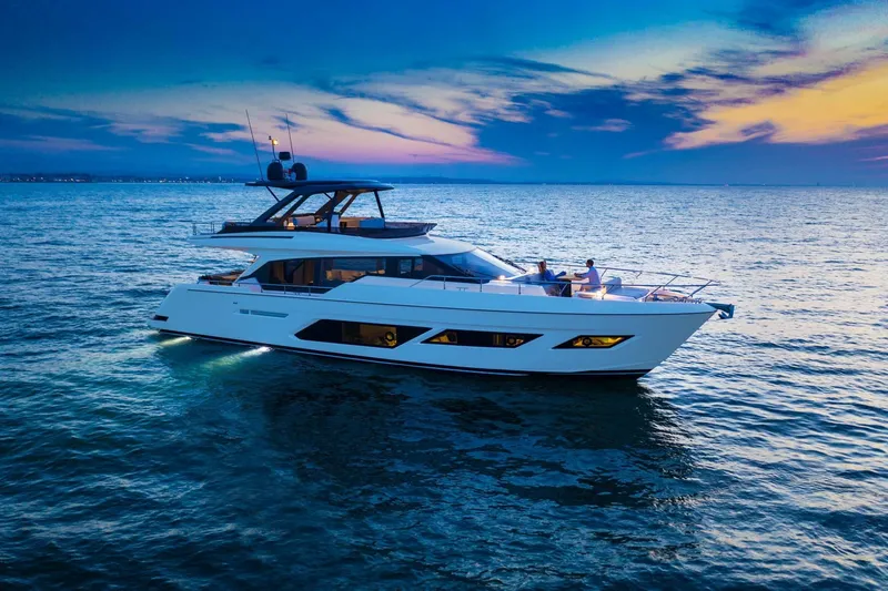  Yacht Photos Pics 2025 Ferretti Yachts 720 cruising at sunset on calm ocean waters.