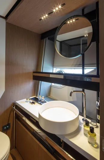  Yacht Photos Pics Luxury bathroom in 2025 Ferretti Yachts 720, featuring modern sink and elegant design.
