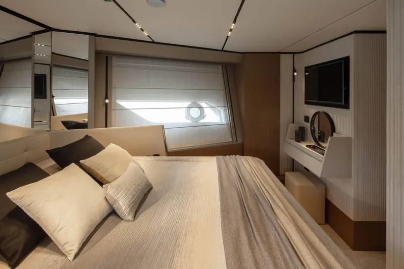  Yacht Photos Pics Luxurious bedroom interior of 2025 Ferretti Yachts 720 with modern design and elegant furnishings.
