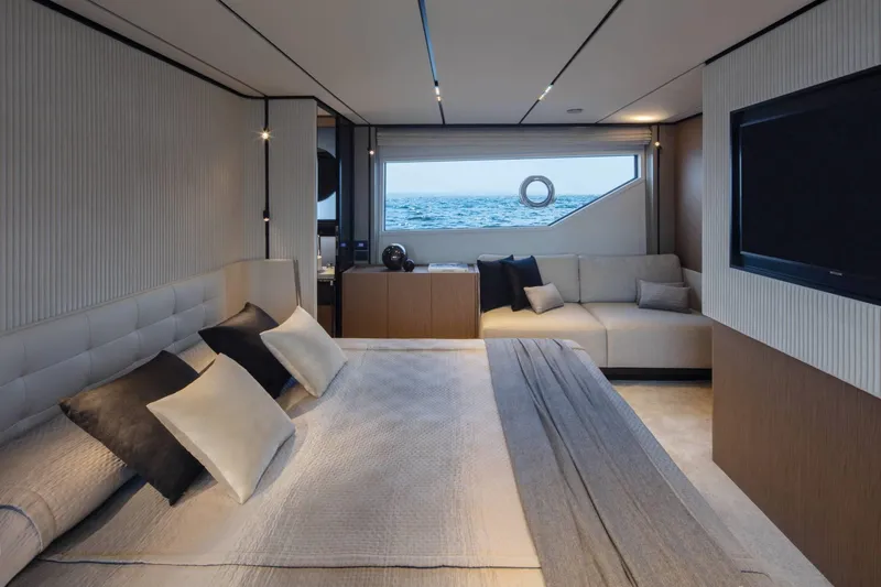  Yacht Photos Pics Luxurious bedroom interior of 2025 Ferretti Yachts 720 with ocean view.