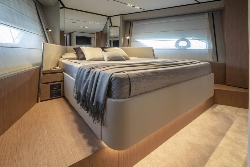  Yacht Photos Pics Luxurious bedroom interior of 2025 Ferretti Yachts 720 with modern design and cozy bedding.
