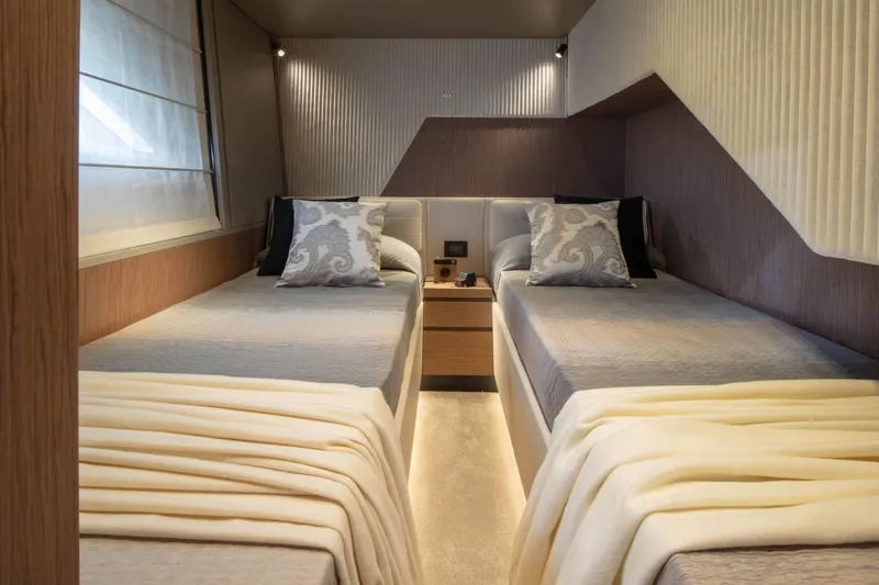  Yacht Photos Pics Luxurious twin bedroom in 2025 Ferretti Yachts 720, featuring elegant decor and cozy bedding.