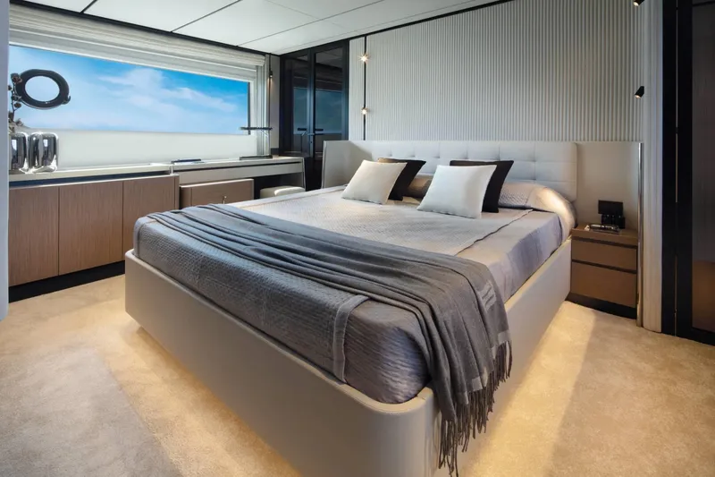  Yacht Photos Pics Luxurious bedroom interior of 2025 Ferretti Yachts 720 with modern design and ocean view.