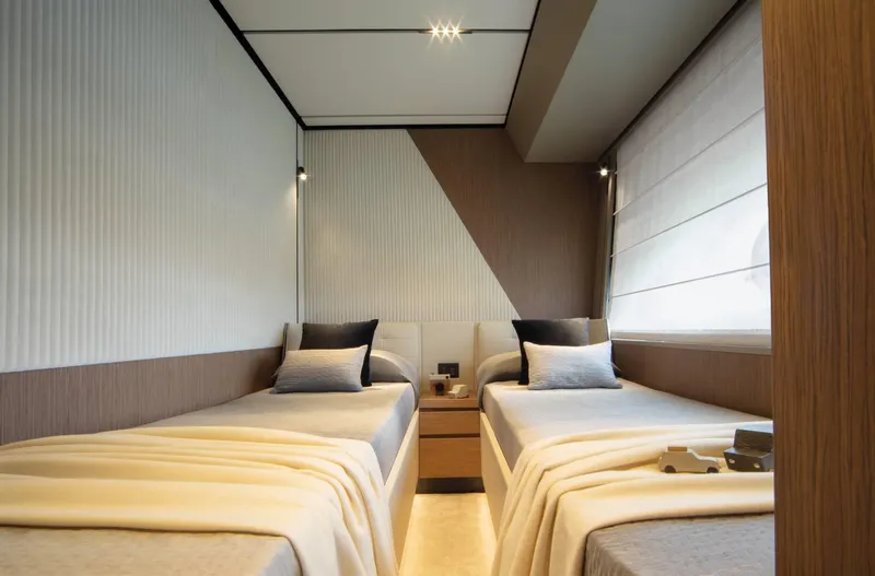  Yacht Photos Pics Luxurious twin bedroom in 2025 Ferretti Yachts 720, featuring modern design and cozy ambiance.