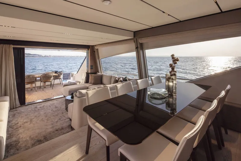  Yacht Photos Pics Luxurious interior of 2025 Ferretti Yachts 720 with ocean view and elegant dining area.
