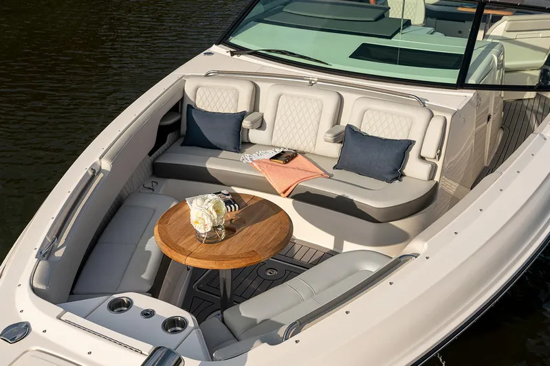  Yacht Photos Pics Manufacturer Provided Image: Luxurious 2025 Sea Ray SLX 400 boat interior with elegant seating and wooden table.