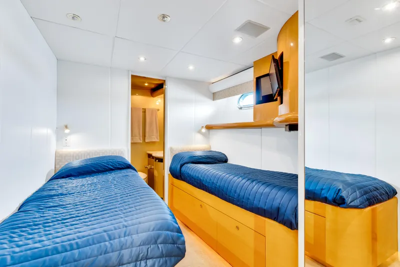 Marvelous Yacht Photos Pics Twin cabin with blue bedding on 1999 Cheoy Lee 74 yacht.