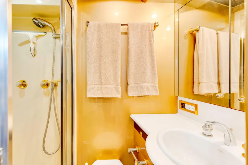 Marvelous Yacht Photos Pics Luxurious bathroom in a 1999 Cheoy Lee 74 yacht with shower and towels.