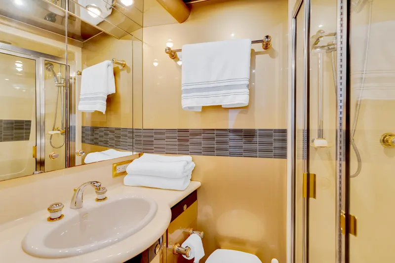 Marvelous Yacht Photos Pics Luxurious bathroom in 1999 Cheoy Lee 74 yacht with elegant fixtures and towels.