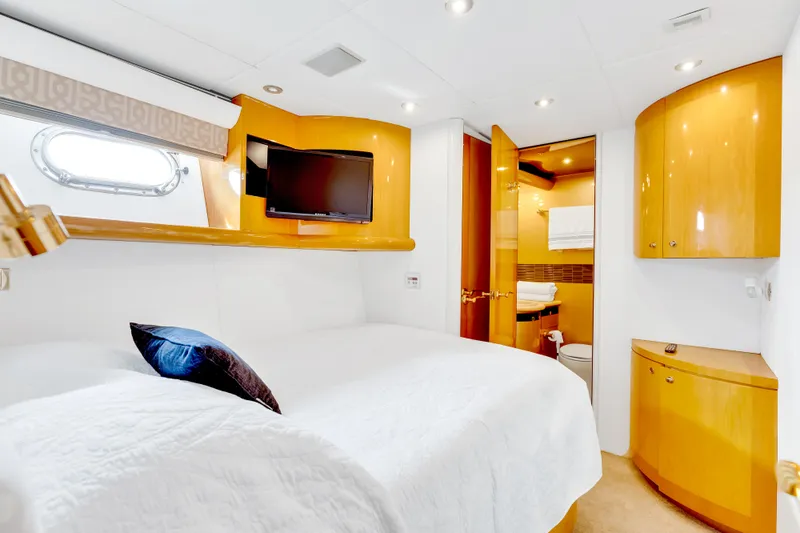 Marvelous Yacht Photos Pics Luxurious bedroom interior of 1999 Cheoy Lee 74 yacht with modern amenities and elegant design.
