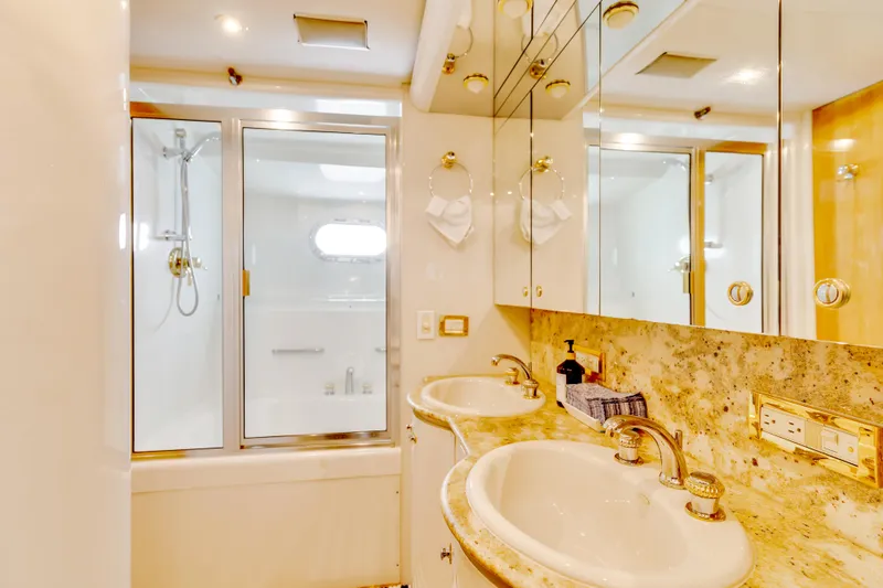 Marvelous Yacht Photos Pics Luxurious bathroom in 1999 Cheoy Lee 74 yacht with dual sinks and glass shower.